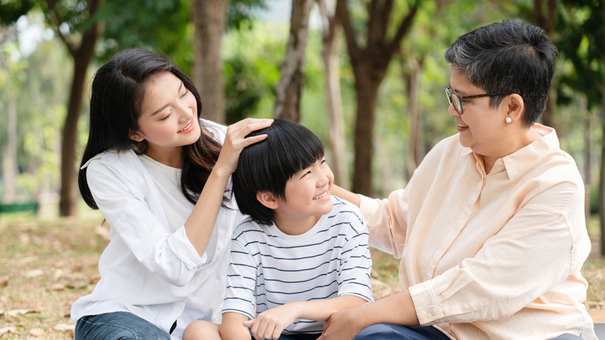 A Family Enjoying A Residence With Green Spaces.